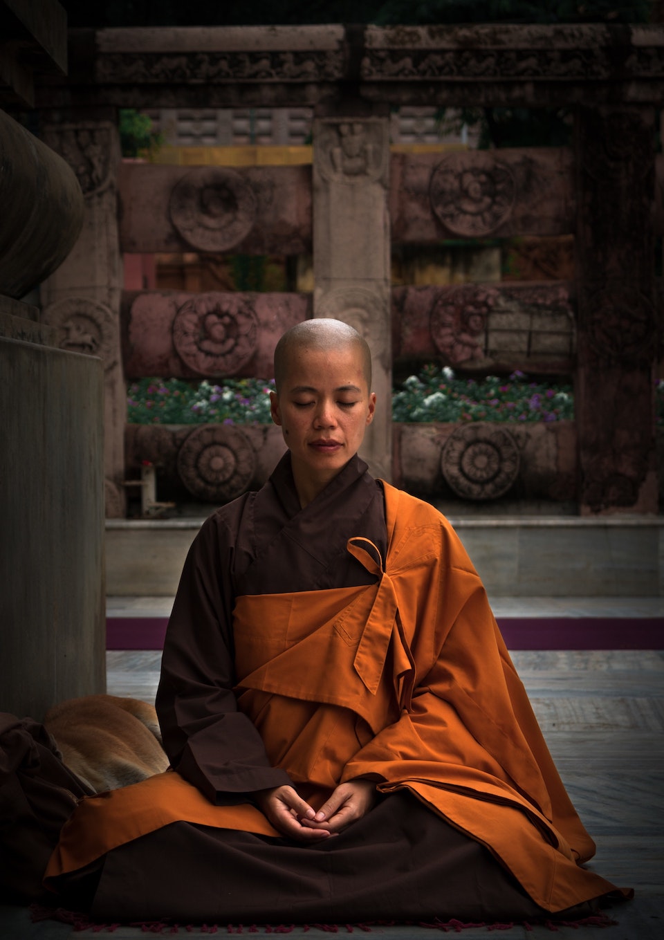 selective-focus-photography-of-monk-during-meditation-2421467