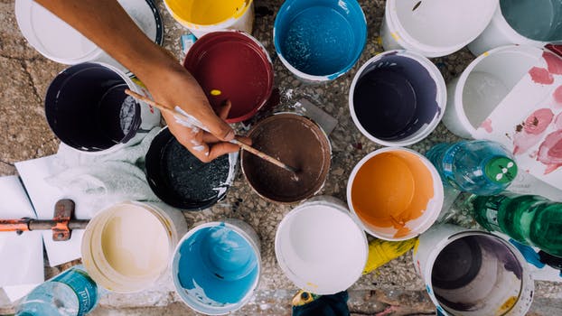 Different color open paint cans